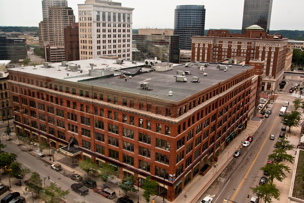 a large brick building with a sky scr on top