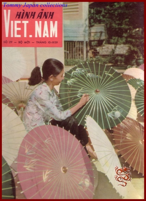 woman sitting with her hand in her mouth and holding an umbrella