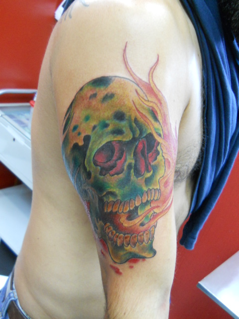 a tattoo is decorated with a skull