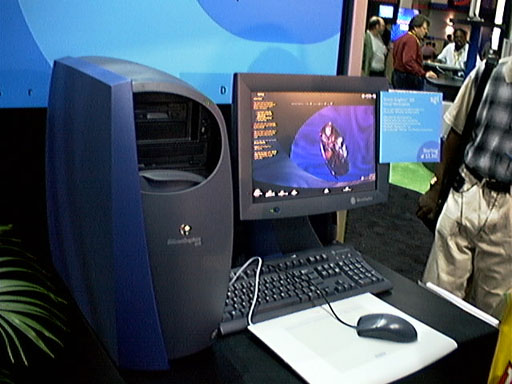 a man standing next to a laptop computer
