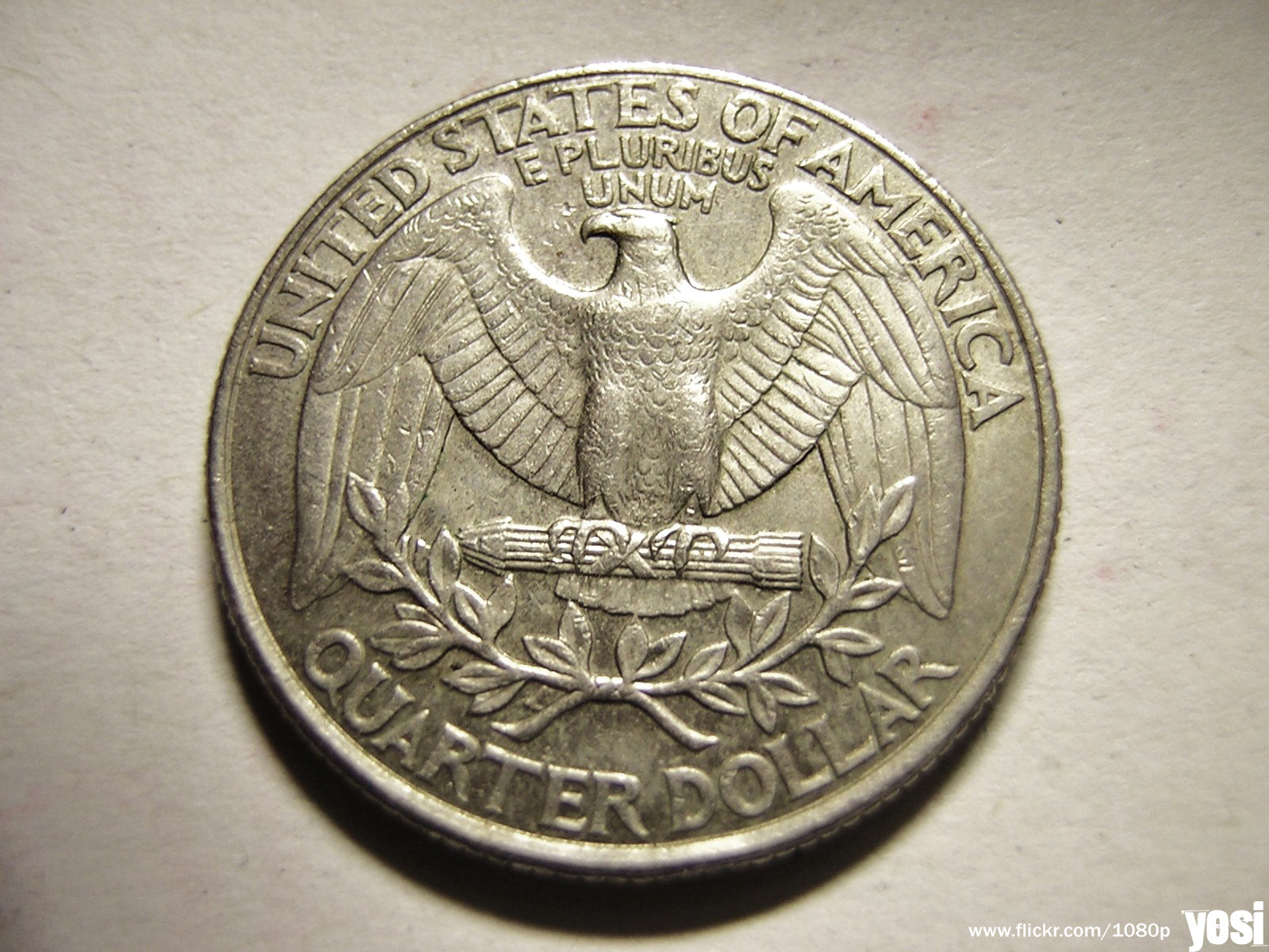 an old us coin showing an eagle in the center