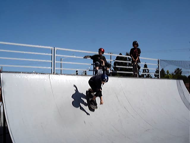 a person riding on top of a white ramp