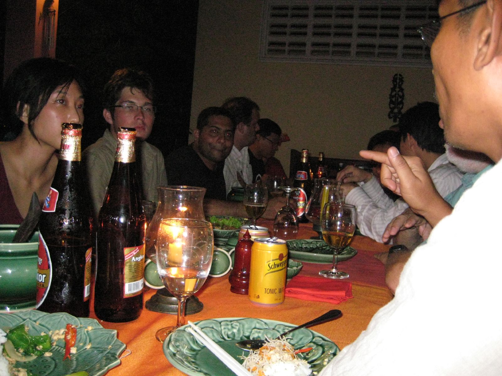 people sit and talk at a dinner table