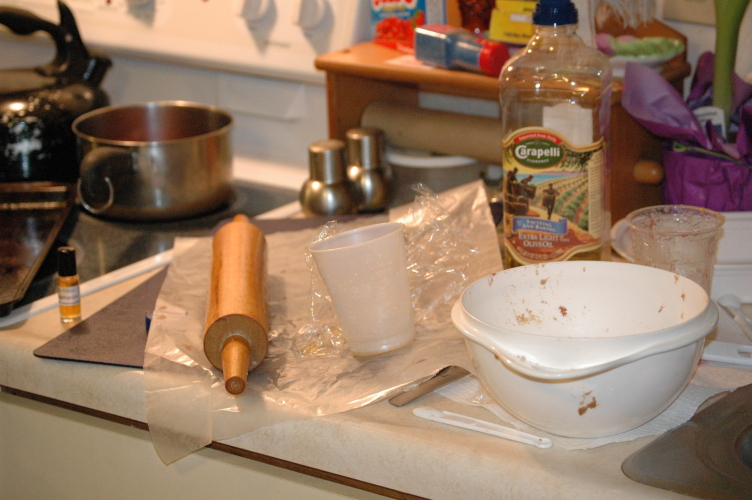 several kitchen supplies on a counter in the middle of the day