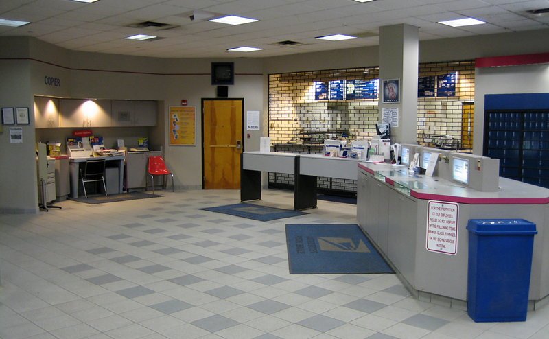 a commercial kitchen with tiled floor and counters