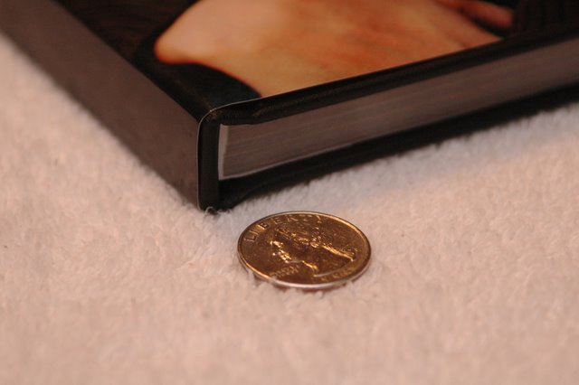 the coin is laying next to a book