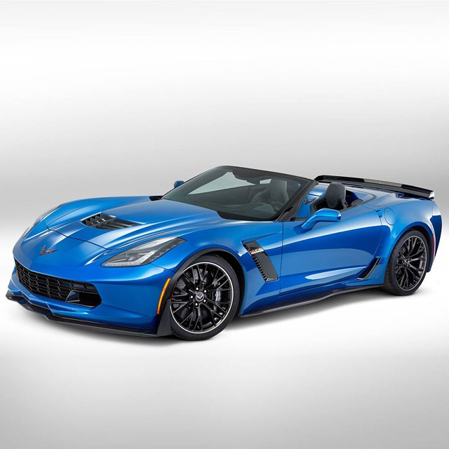 a blue chevrolet sports car, with white background