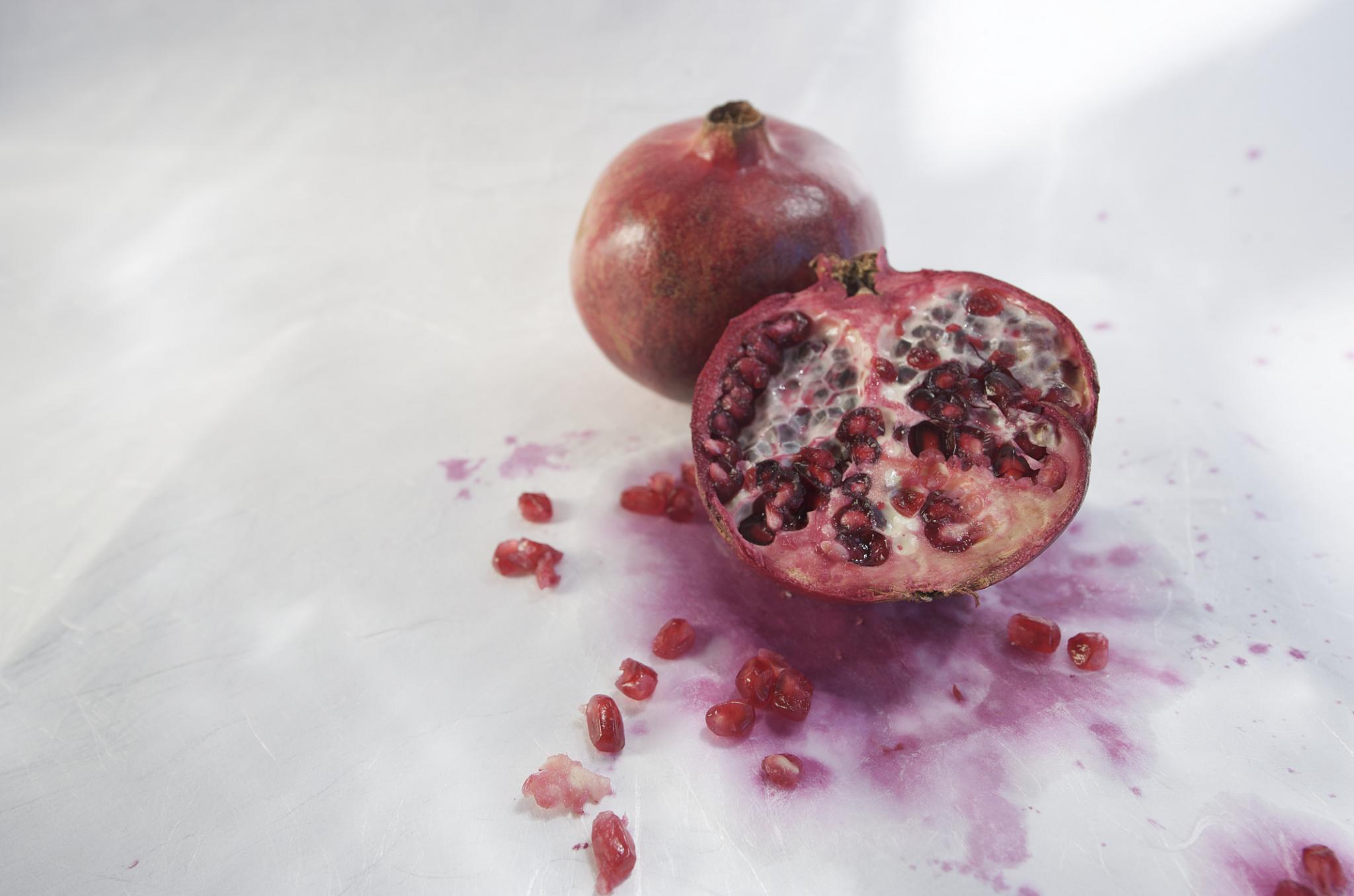 the pomegranate has spilled on it's skin