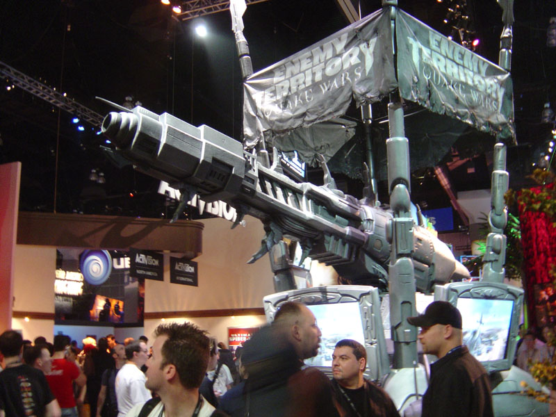 a gun and rifle on display with people inside