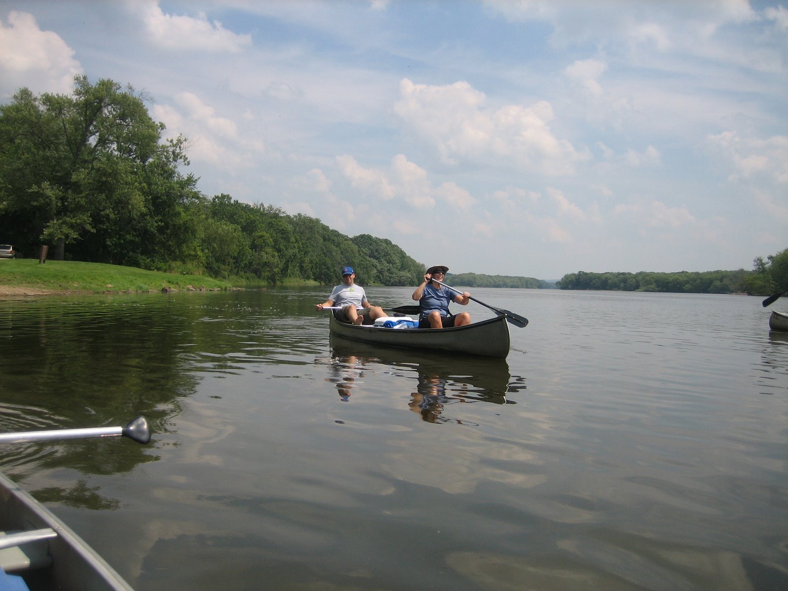 two people on a boat in a body of water