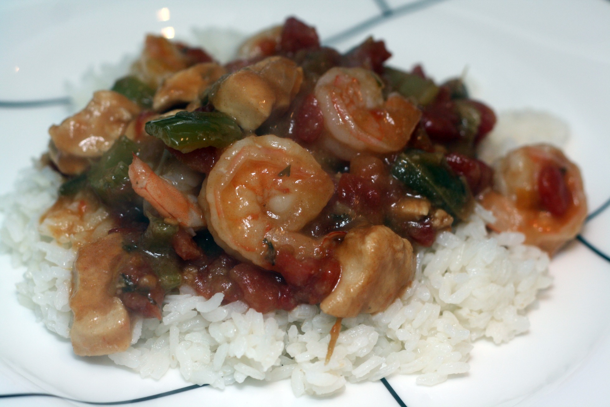 a close - up of a dish of rice, shrimp and beans