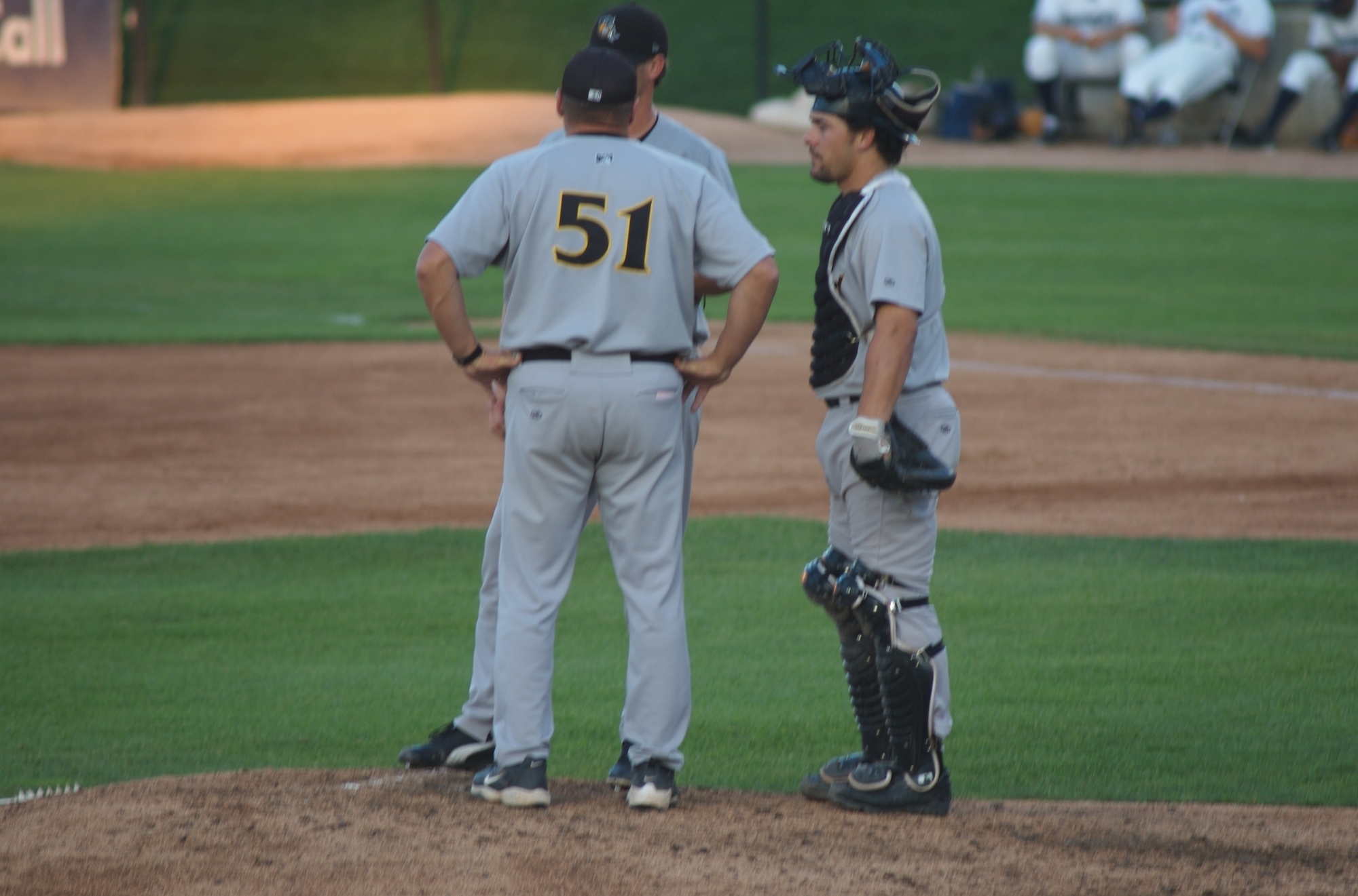 two baseball players talking on the field during a game
