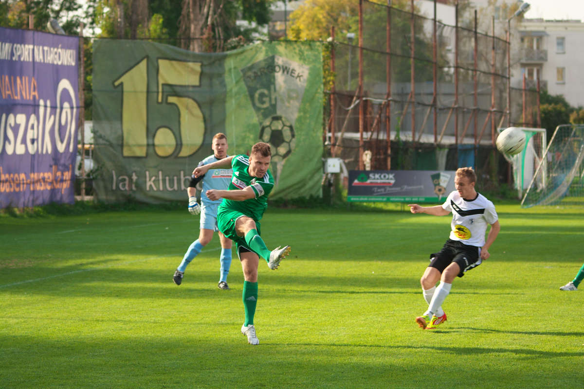 some soccer players are playing soccer on a field