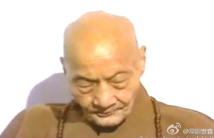 an old man with eyes closed wearing brown
