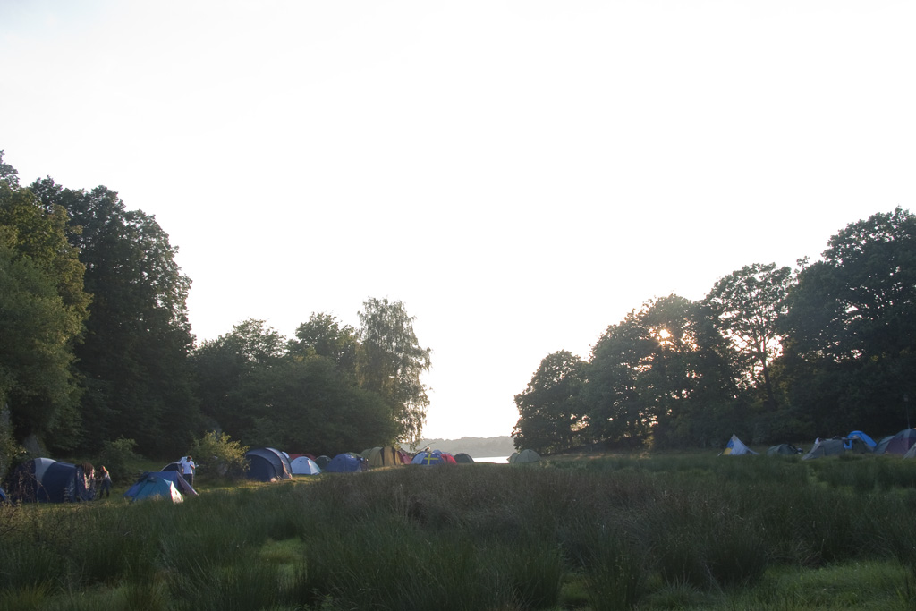 the tents are lined up in the meadow