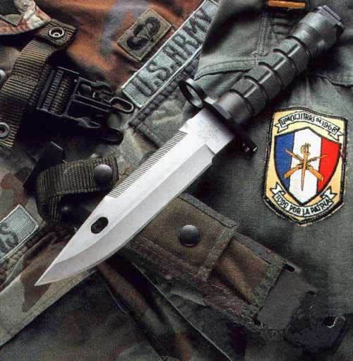 a knife with military badges on the side