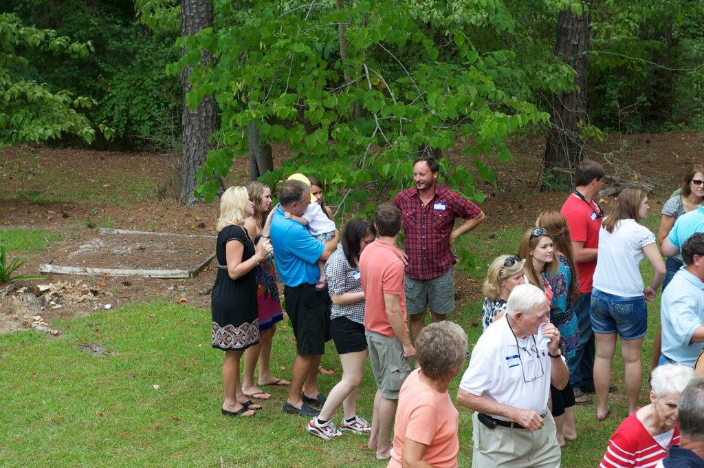 a large group of people are in the grass