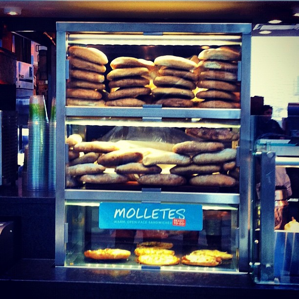 a close up of stacks of doughnuts in a display case