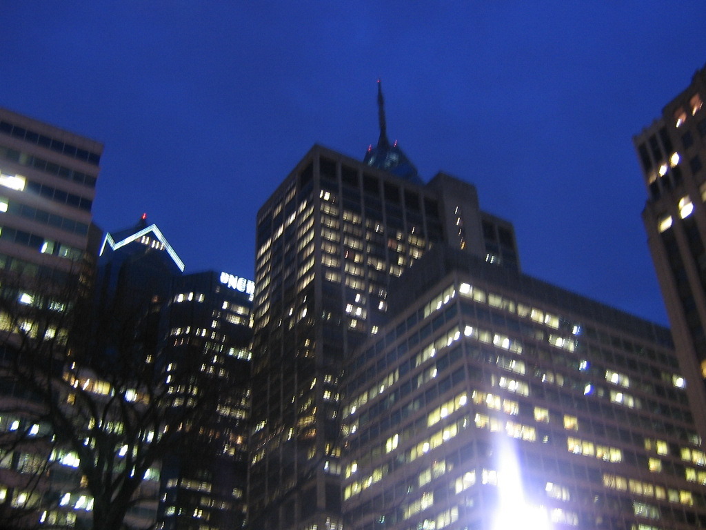 a view of a city at night taken from the ground level