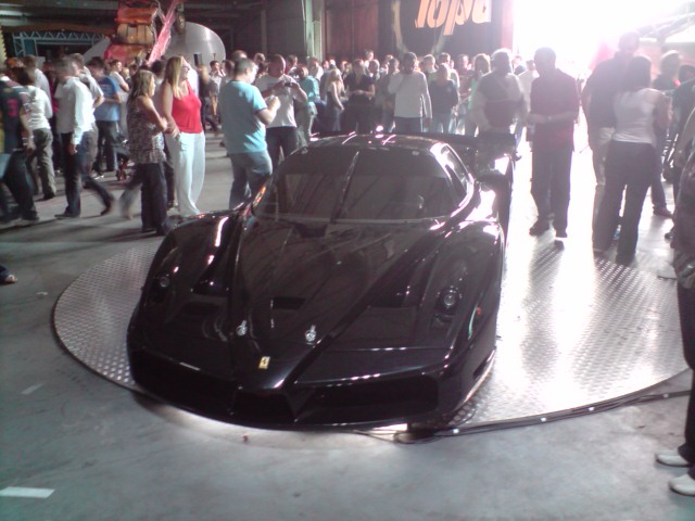 a black sport car on display for the first time