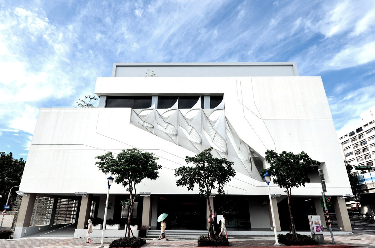 a white building on the corner of a street