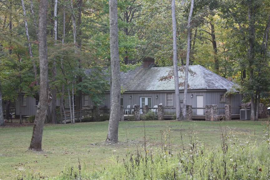 an old farm house is surrounded by trees