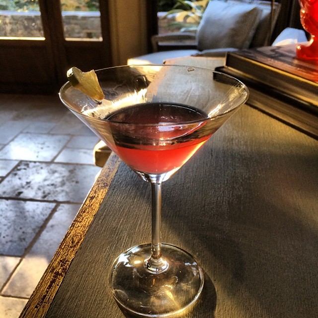 a small martini cocktail sits on a counter
