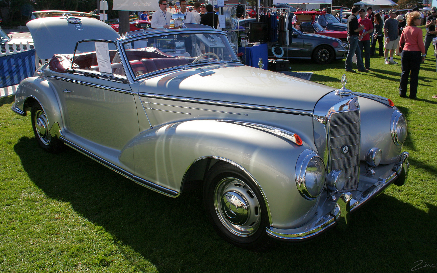a vintage car on display at an automobile show