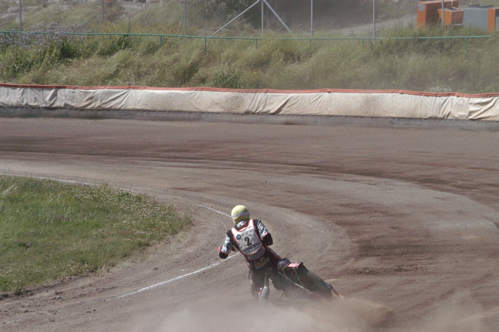 a motorcyclist makes a sharp turn in an intersection