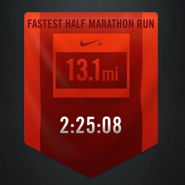 the distance sign for the first half marathon run