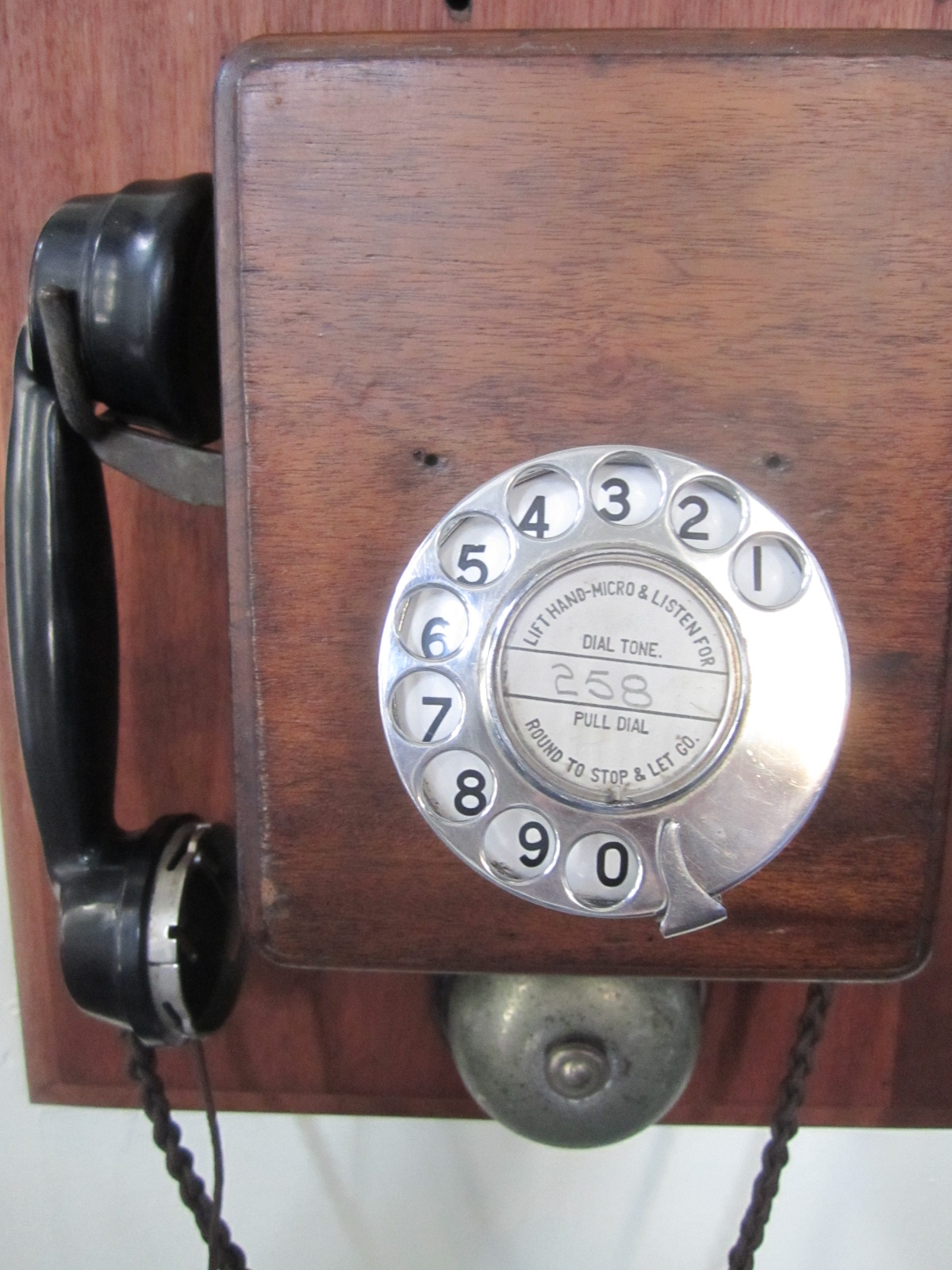 a close up of a phone on a wall