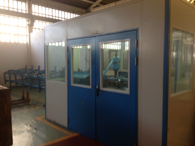 an empty room with double doors, some of which are blue