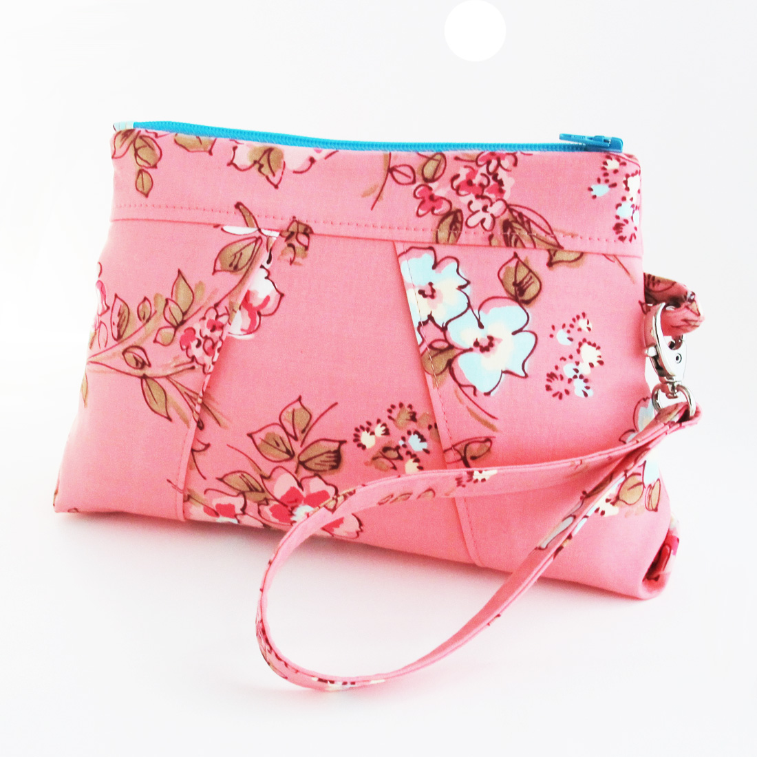 the pink purse has flowers and a blue strap