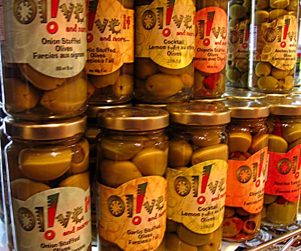 jars filled with olives on display for sale