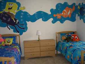 this is a child's room with three identical beds and a blue mural