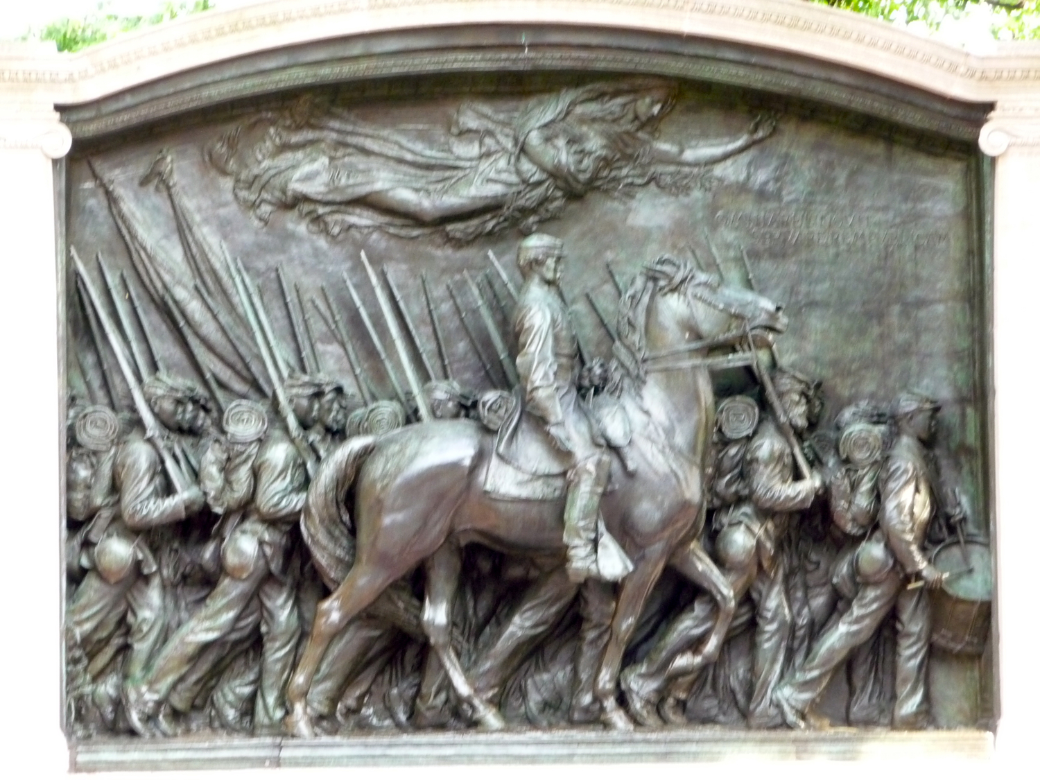 this is a statue depicting a war scene on a plaque