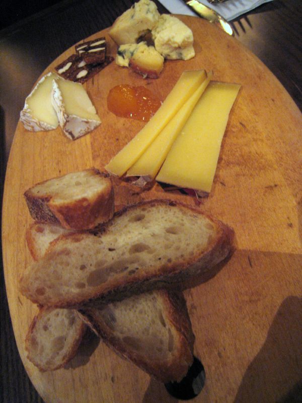 an assortment of different types of cheese on bread