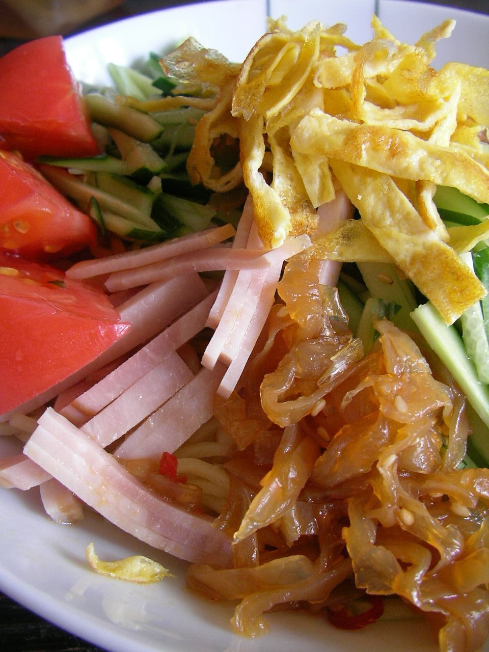 a white plate with various foods on it