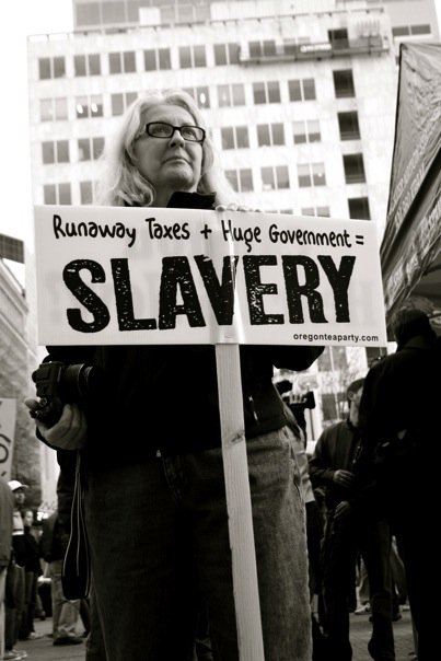 the woman is holding a sign with words that read sleverry