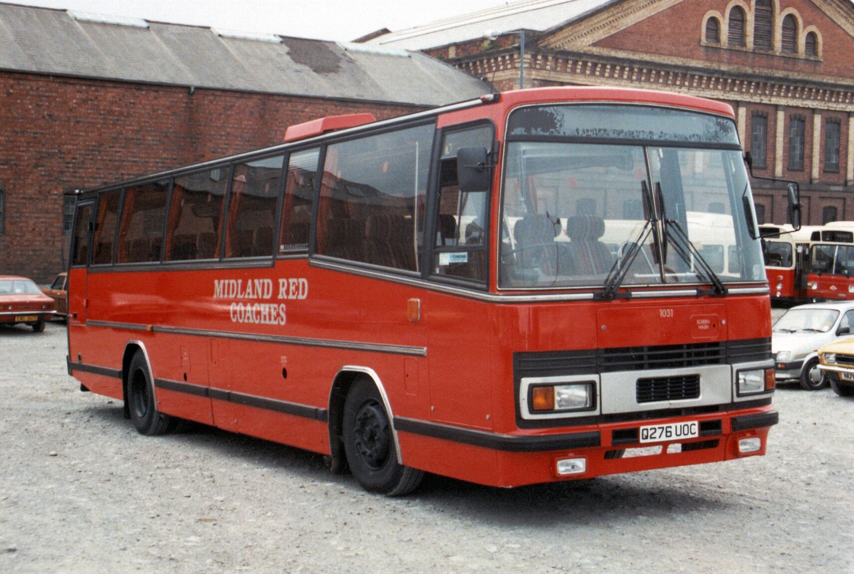 a bus is parked in front of an old building