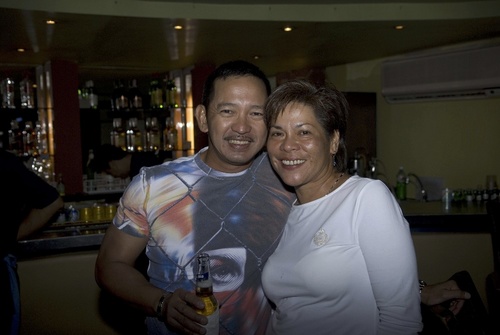 a man and woman posing for the camera together