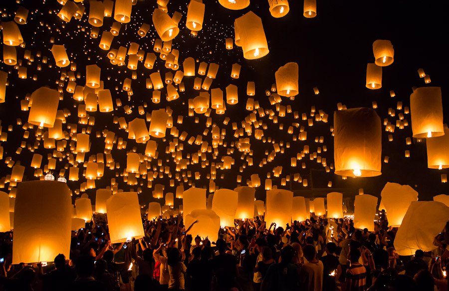 thousands of lighted lanterns in the dark sky