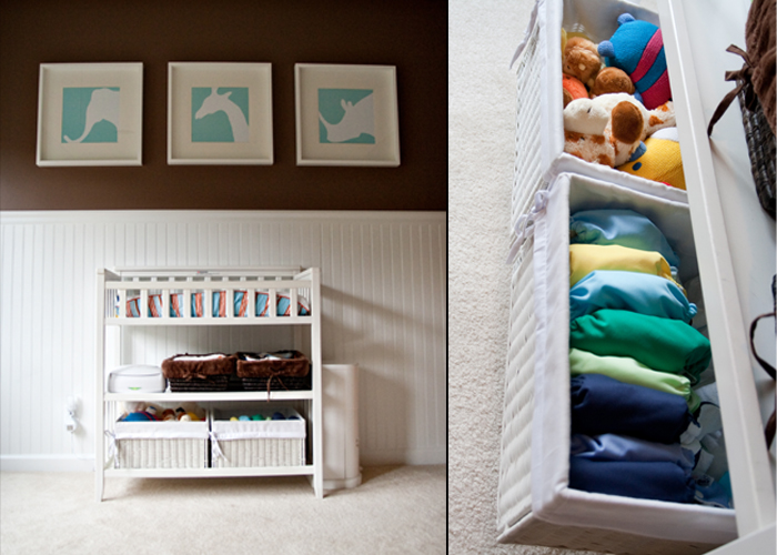 an organized shelf in a nursery shows the open shelves and colorful blankets