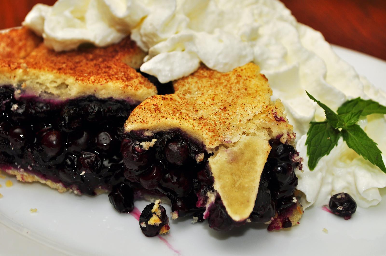 this blueberry cobbler is served with whipped cream