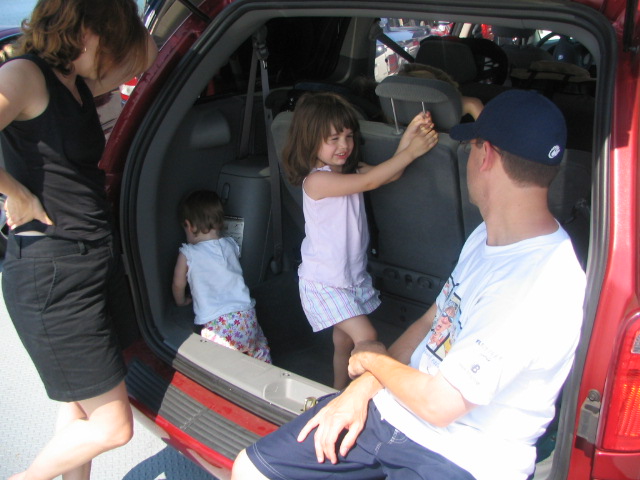 a group of people that are inside a car