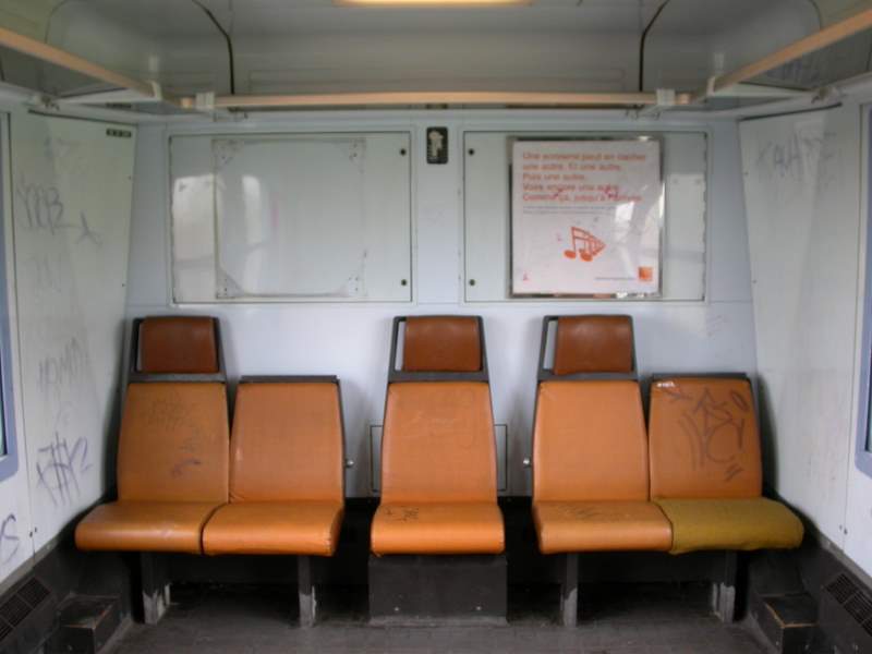 a group of empty seats in a train car