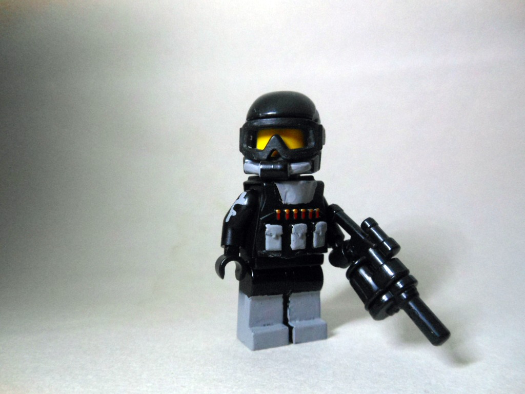 this is a lego man with a gun