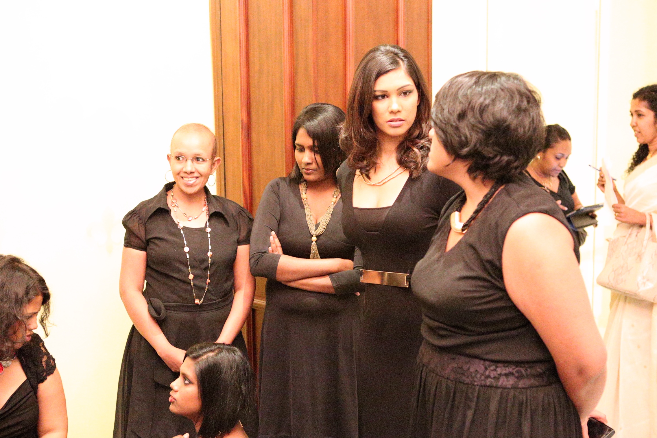 group of people having a discussion in a room