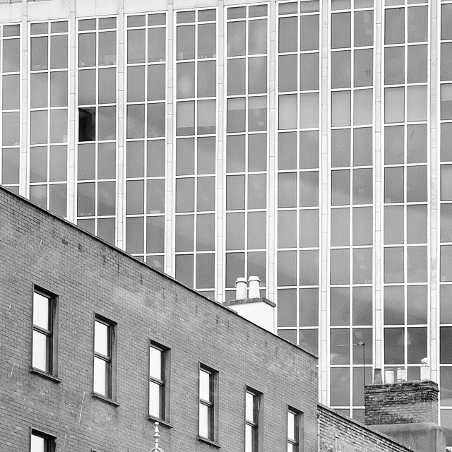 an old building in a black and white pograph