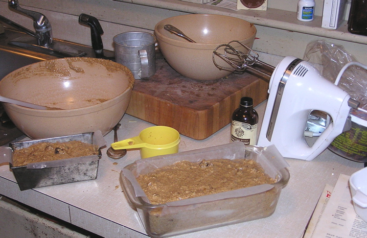 kitchen counter covered with an assortment of ingredients for making baked goods